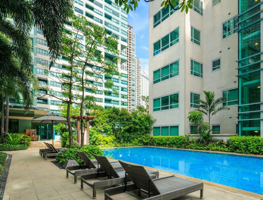 city hotel resort condo urban high rise chair pool swimming pool apartment building